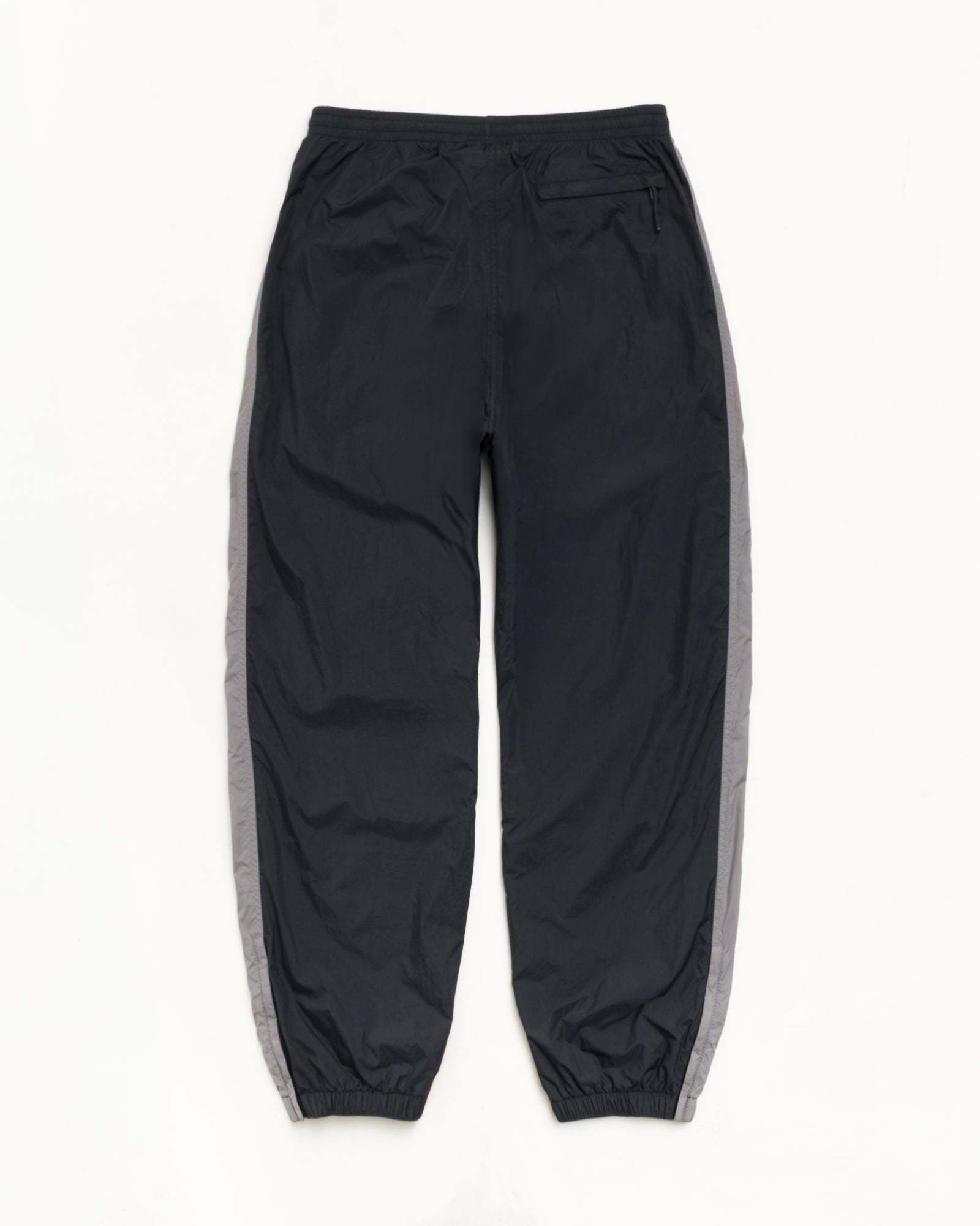Stussy Side Stripe Track Pant tuta nera nylon relaxed